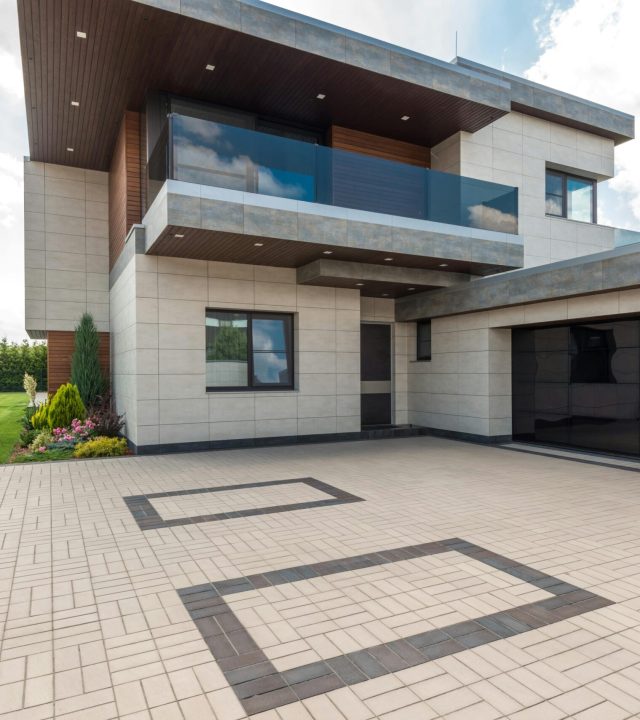 A stylish modern minimalist house exterior with clean lines and geometric shapes.