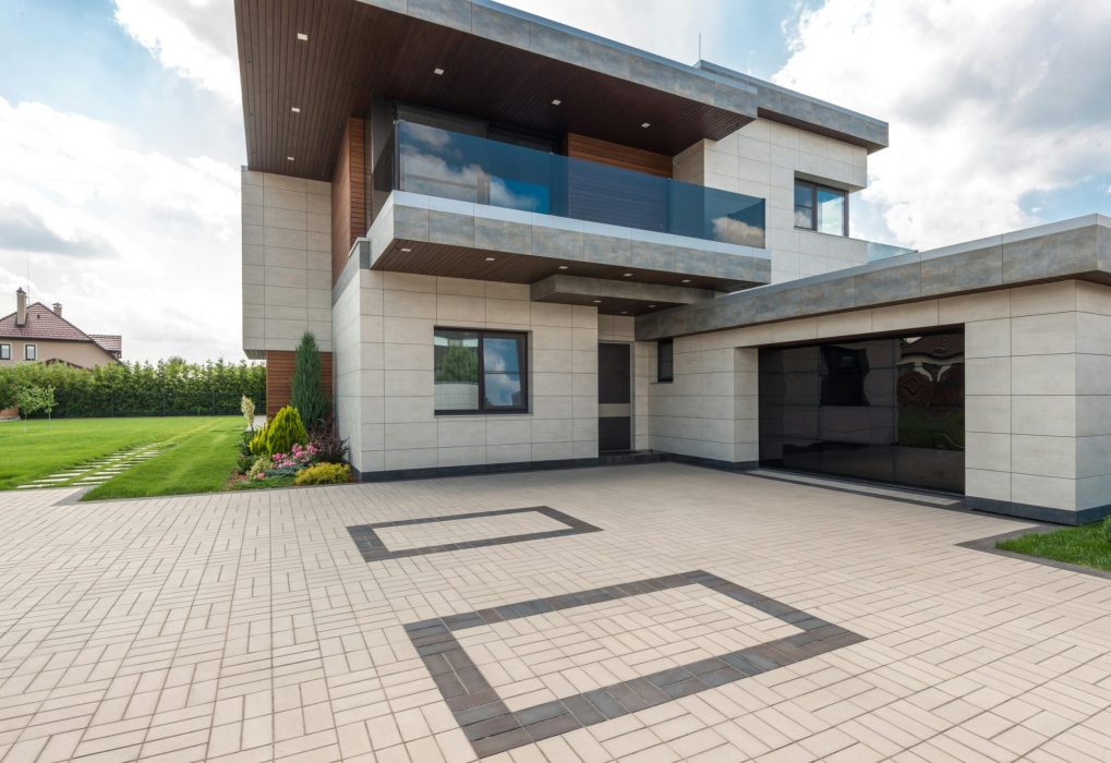 A stylish modern minimalist house exterior with clean lines and geometric shapes.